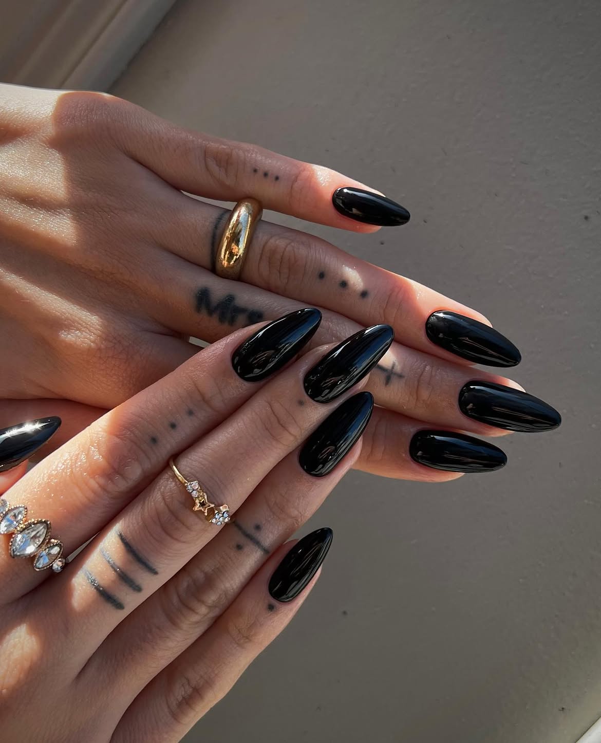 Glossy Black Stiletto Nails