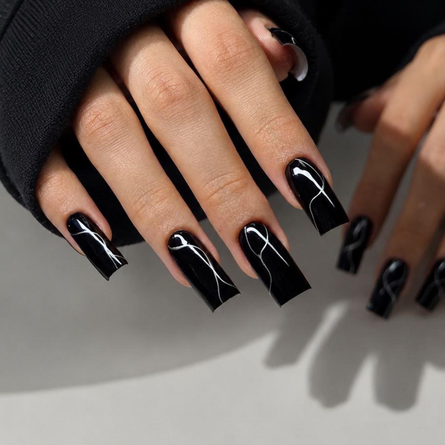Glossy Black Swirl French Tip Coffin Nails