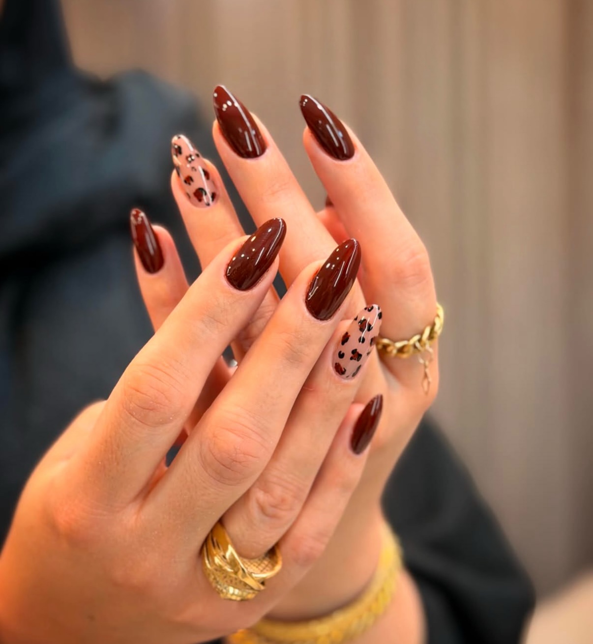 Glossy Deep Brown Almond Nails with Leopard Art