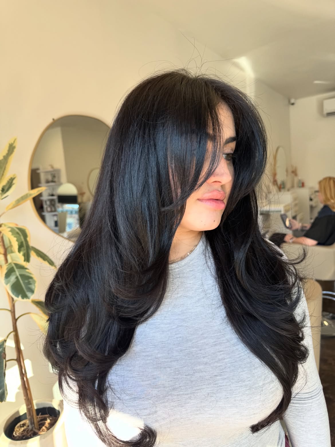 Glossy Long Layers With Voluminous Curtain Bangs