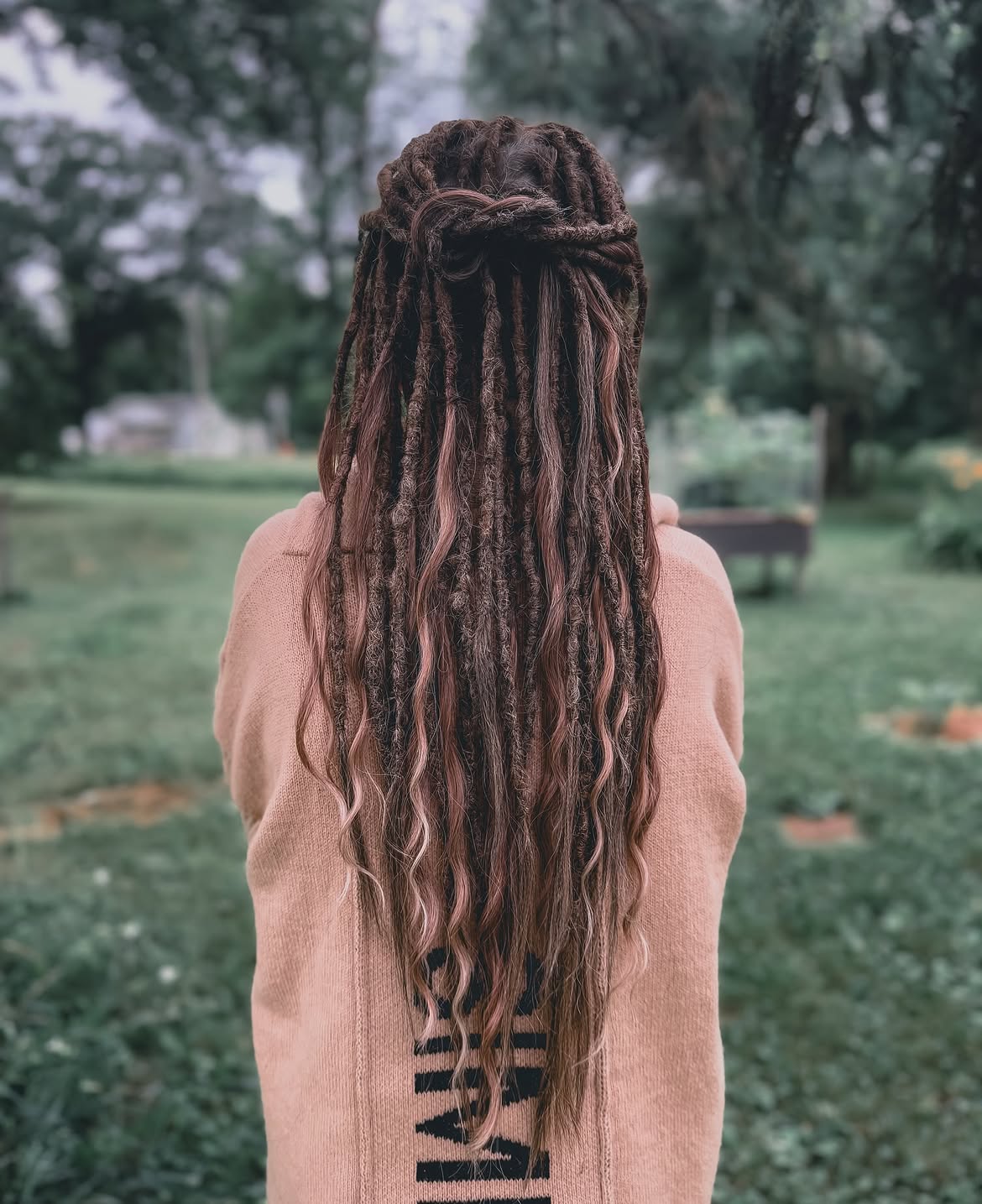 Half Up Twisted Dreadlock Style In Brown