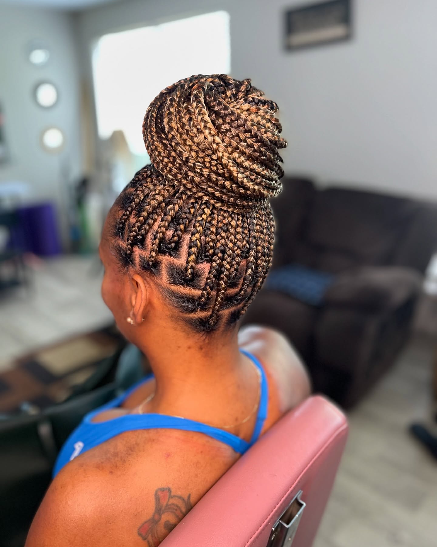 High Bun Knotless Braids With Honey Blonde Highlights