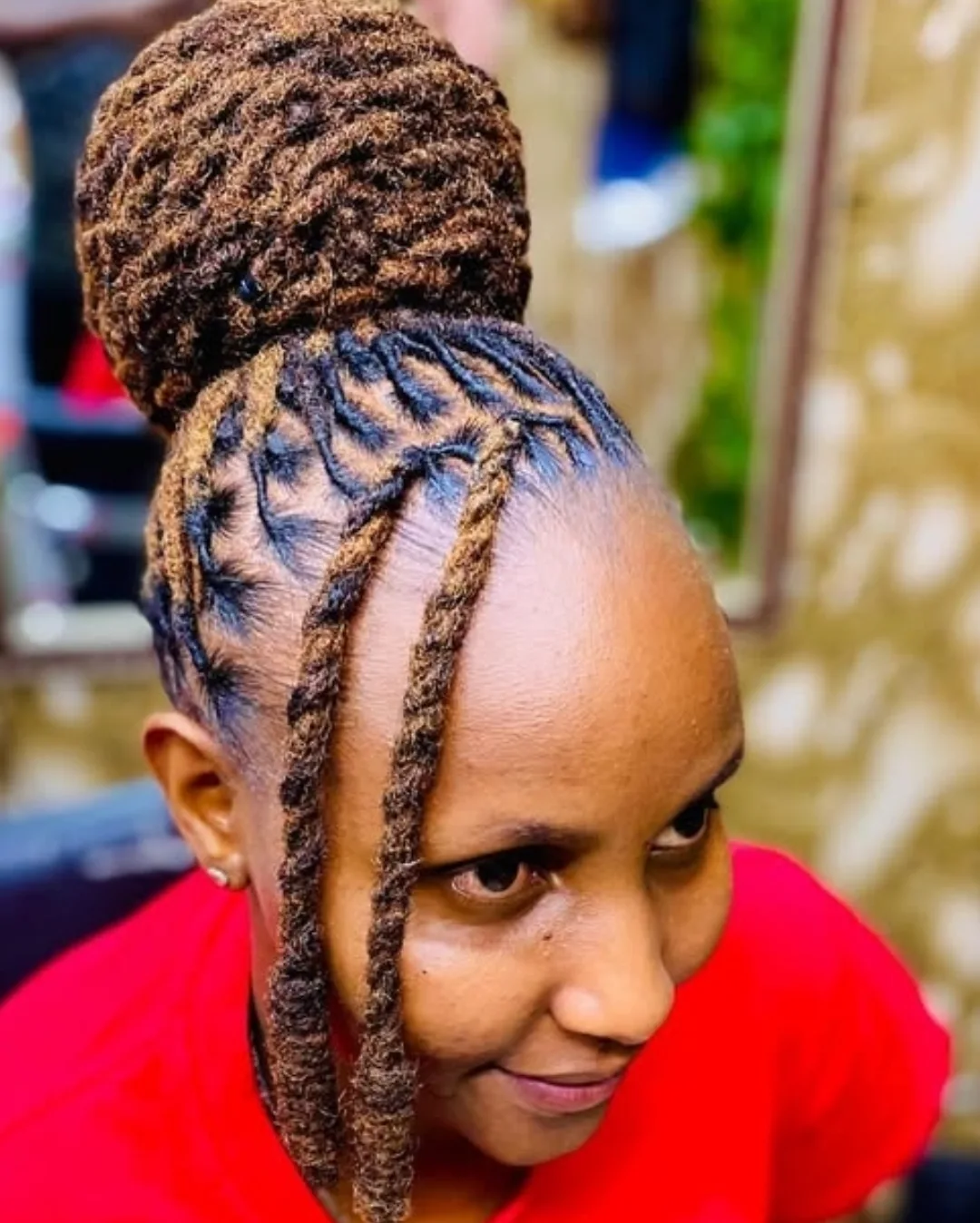 High Twisted Loc Bun With Face Framing Strands