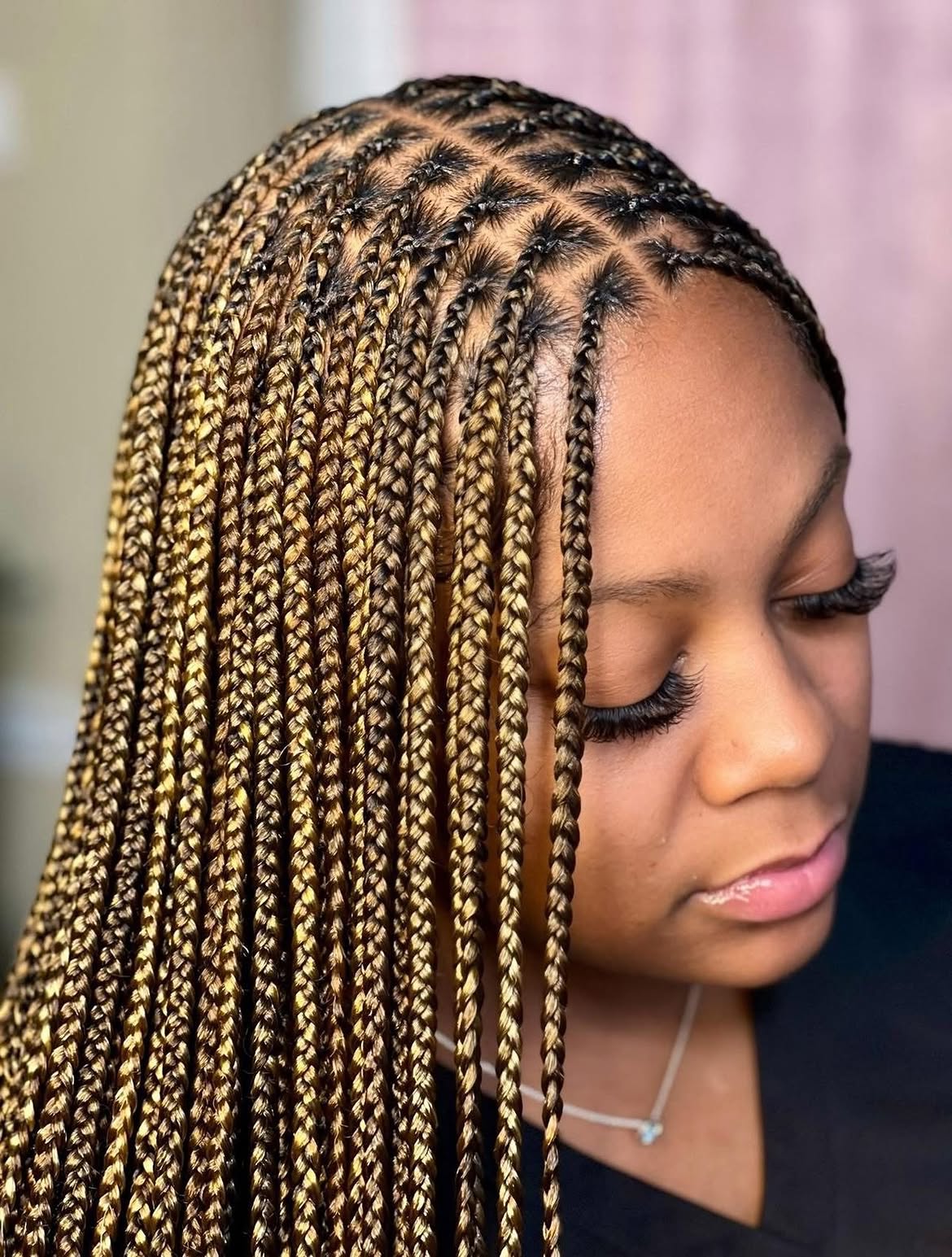 Honey Blonde Knotless Braids With Defined Parting