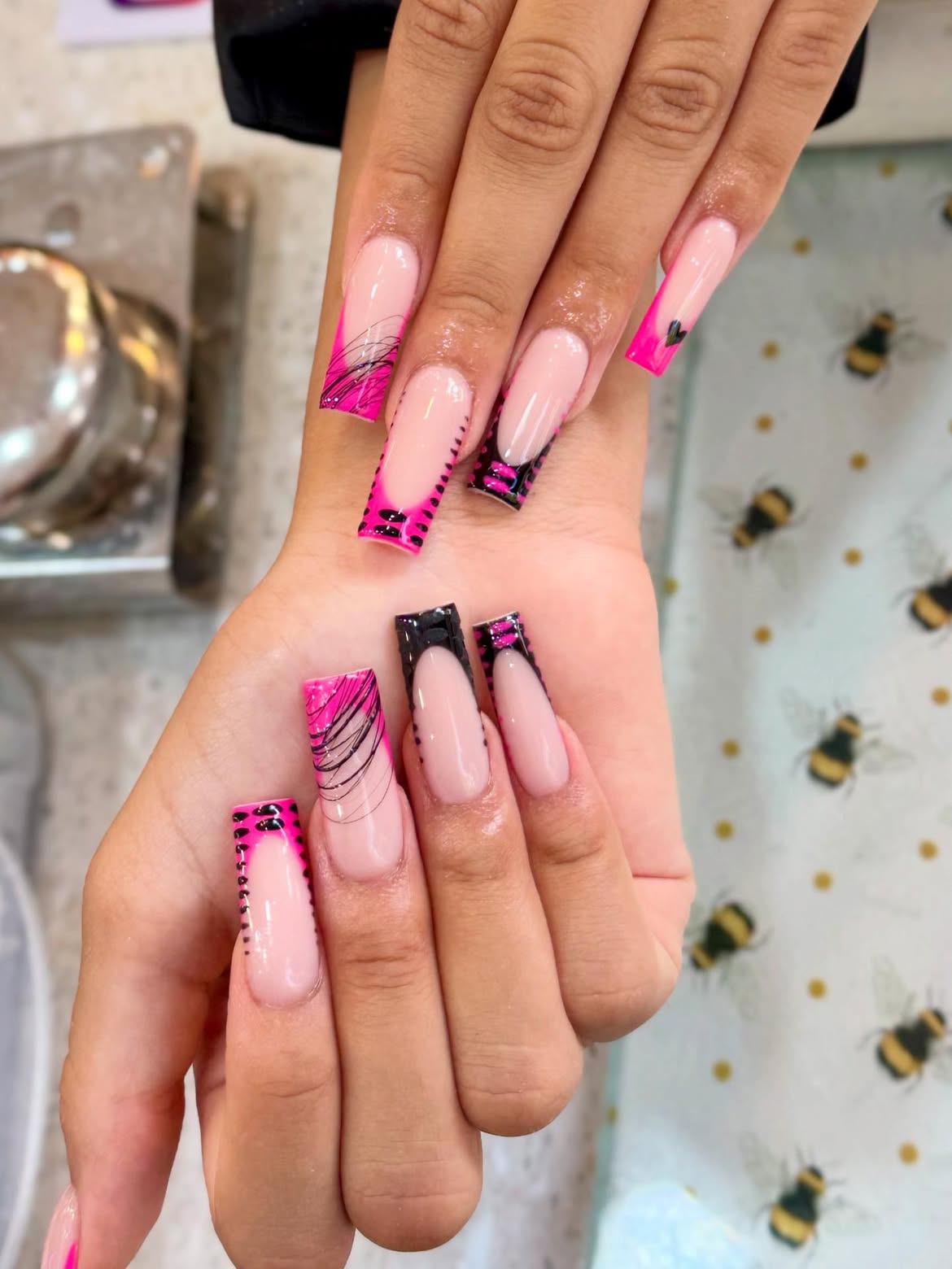 Hot Pink French Tip Coffin Nails with Swirl Art