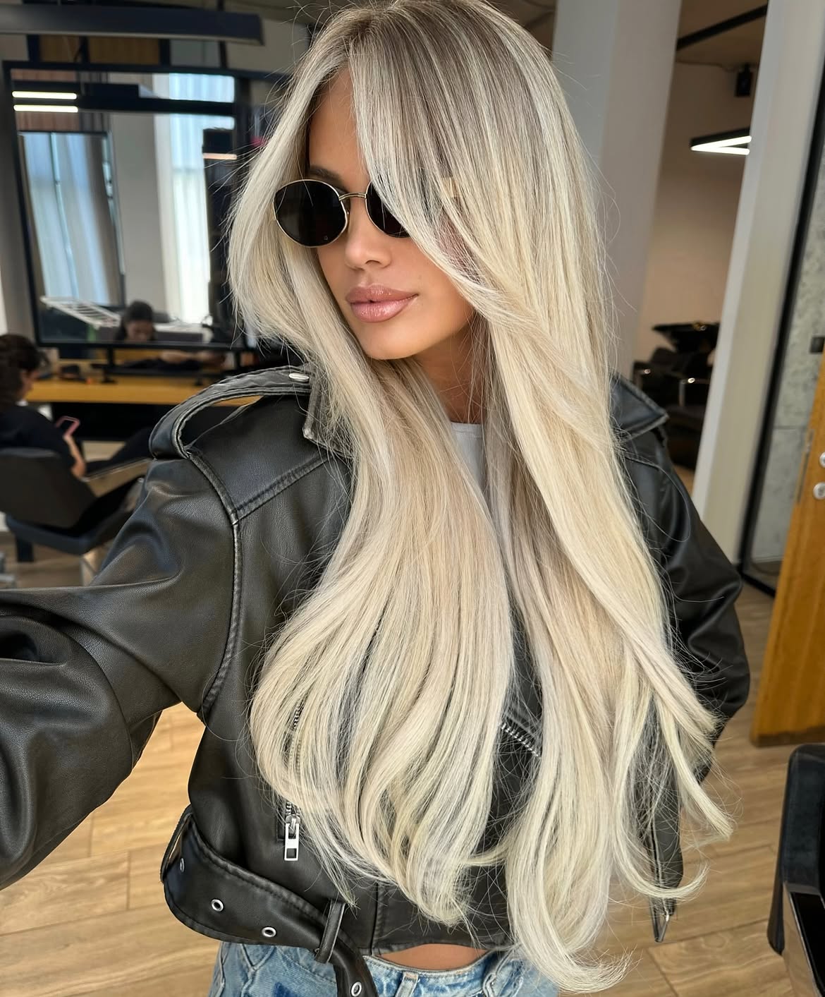 Icy Platinum Blonde With Voluminous Curtain Bangs