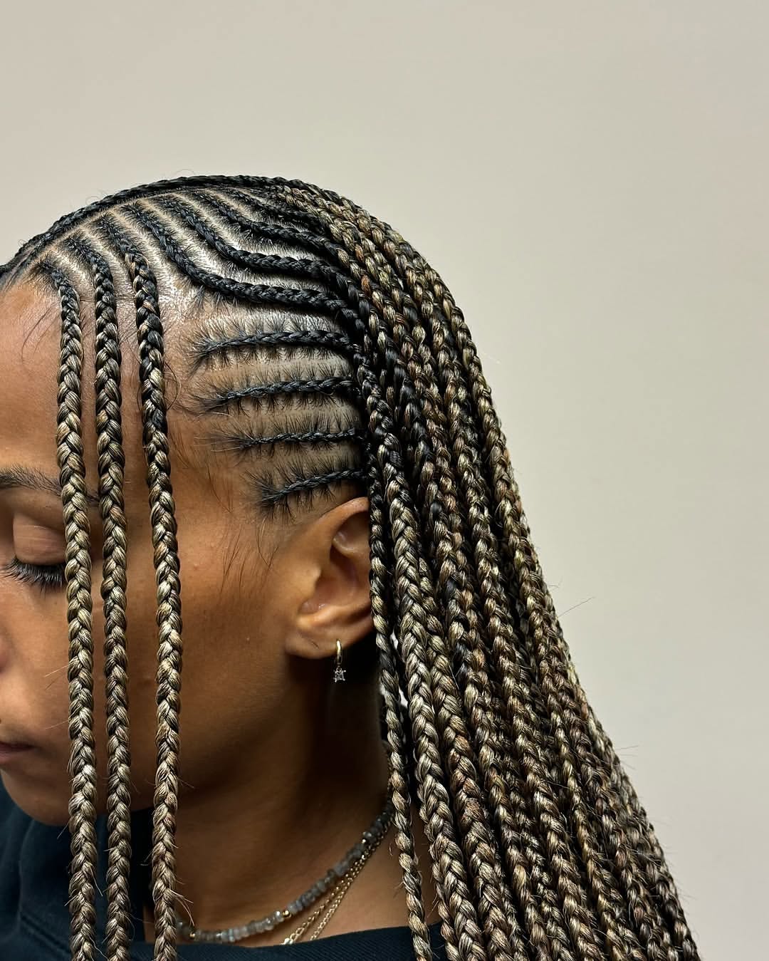 Intricate Feed In Cornrows With Mixed Blonde Tones
