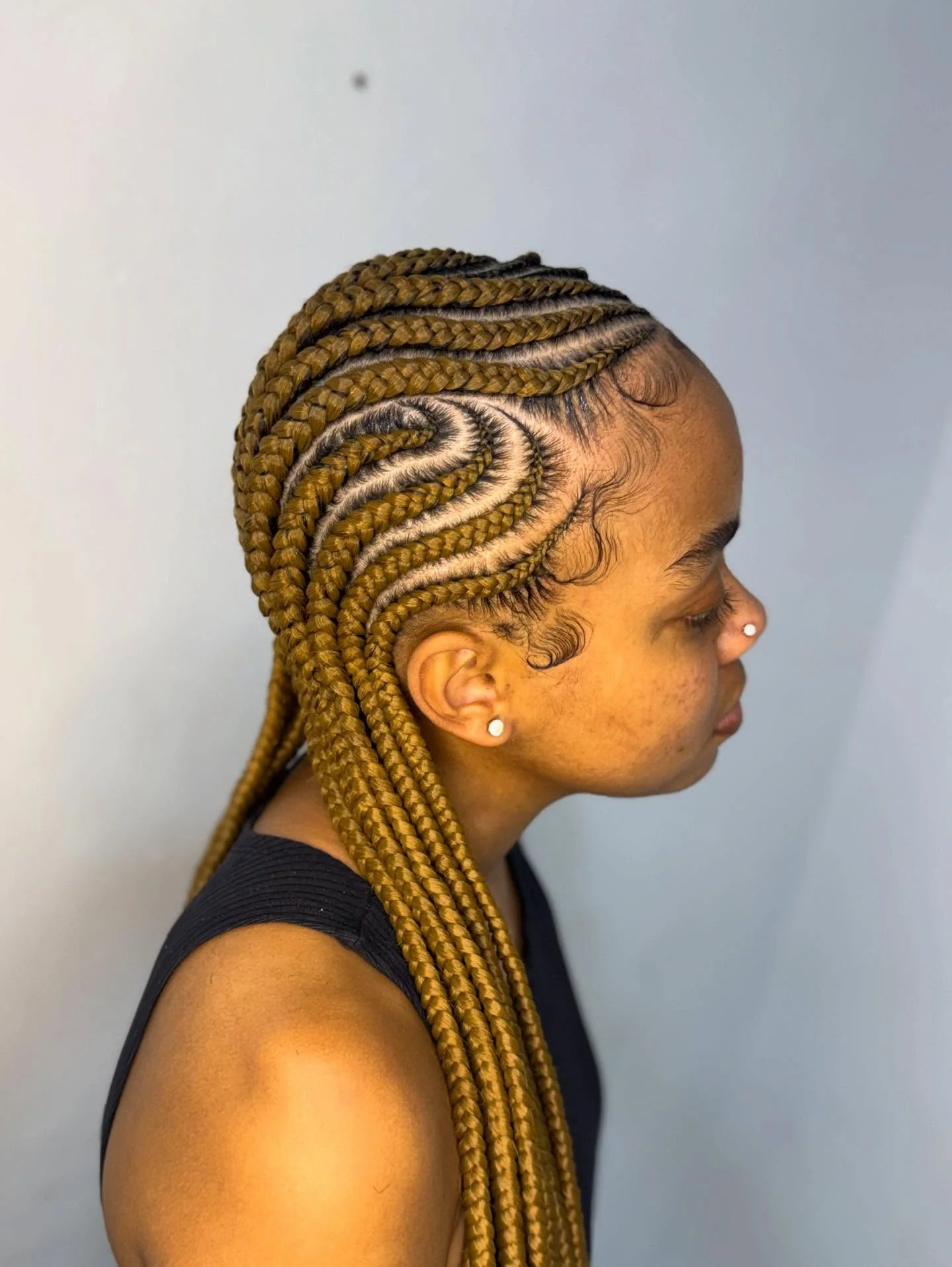 Intricate Swirl Pattern Cornrow Braids In Honey Blonde