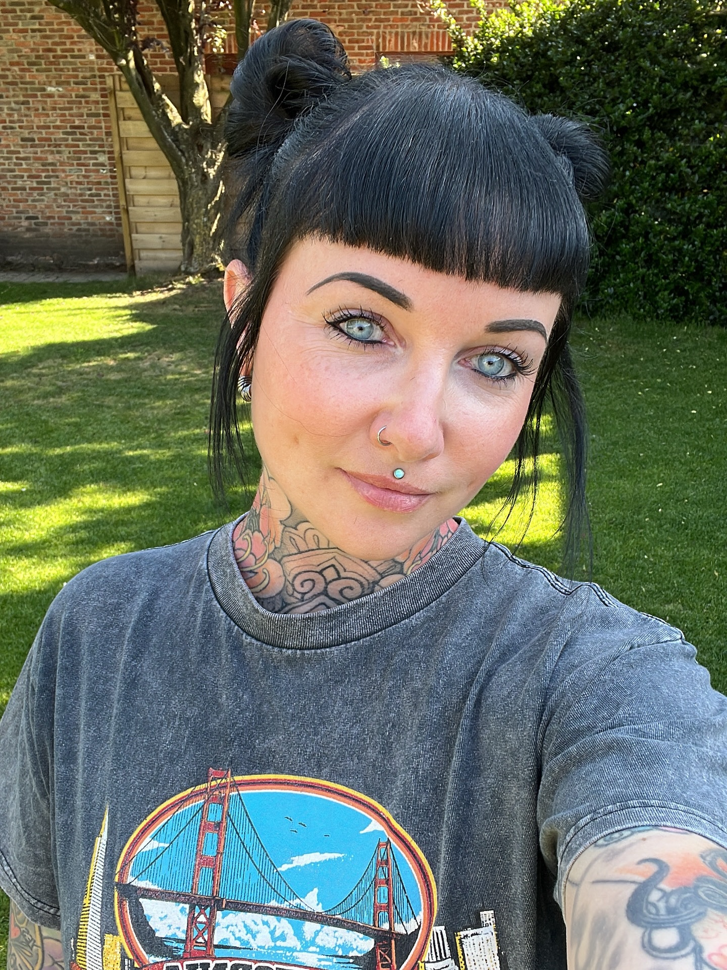 Jet Black Space Buns With Blunt Baby Bangs