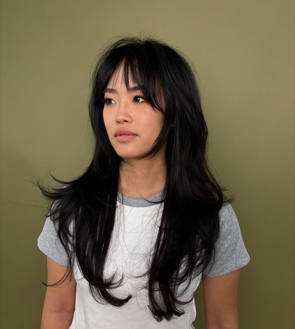 Long Feathered Layers With Wispy Curtain Bangs