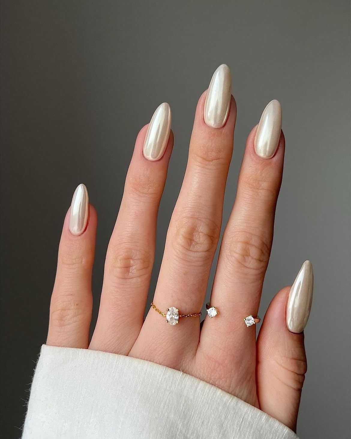 Luminous Pearl Chrome Almond Nails