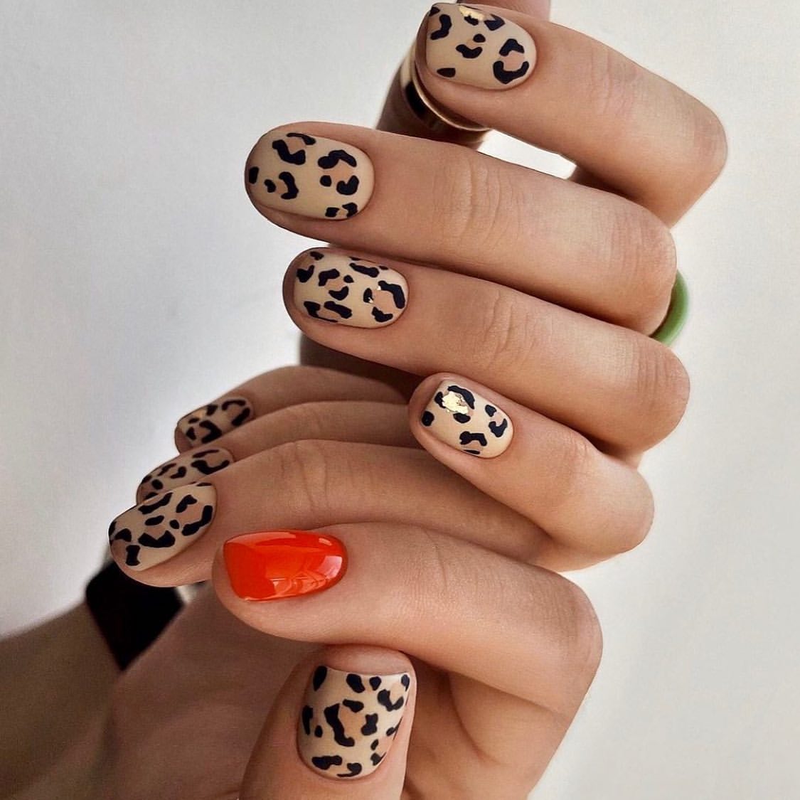 Matte Leopard Print with Glossy Orange Accent Nail