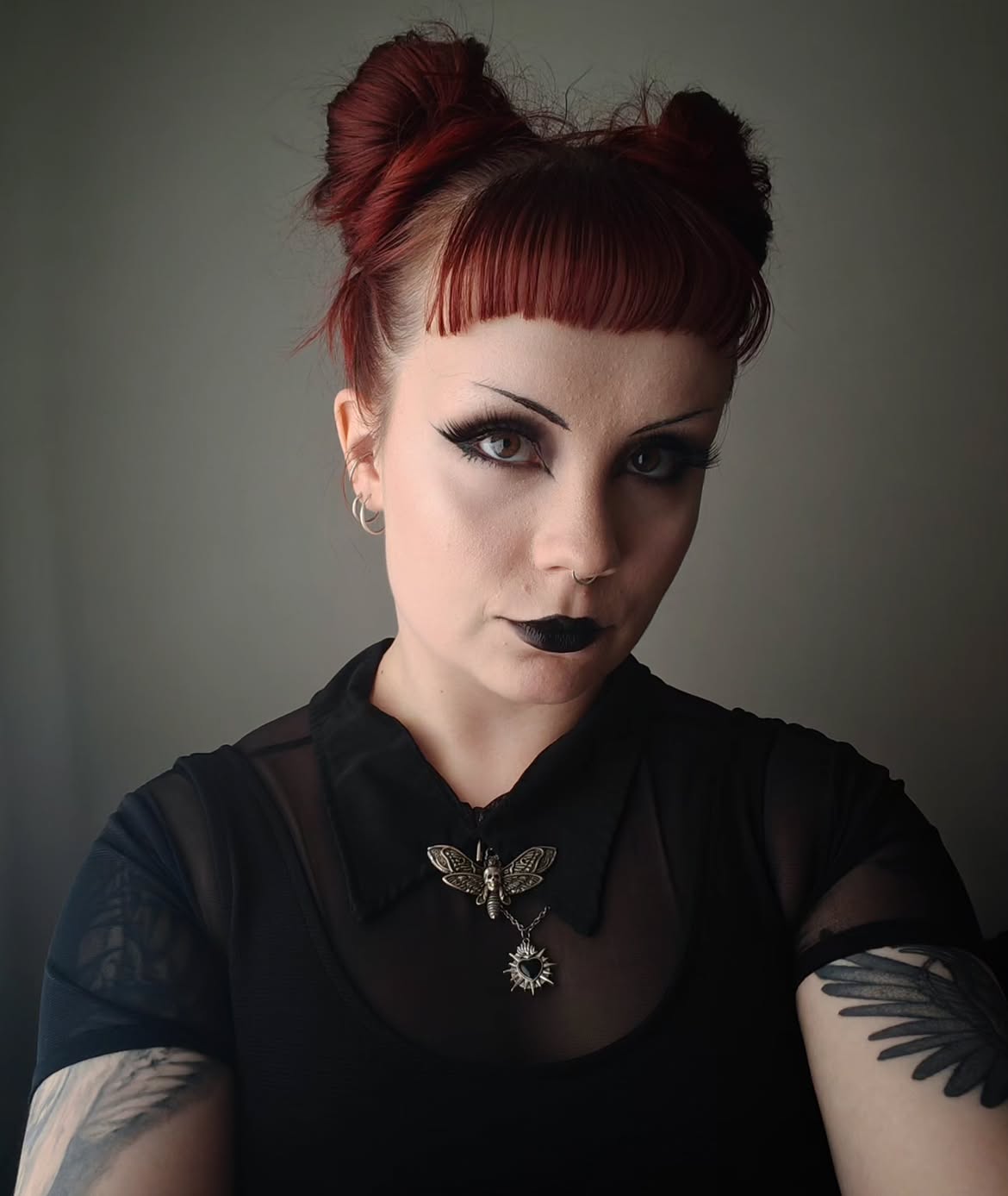 Messy Deep Red Space Buns With Blunt Baby Bangs