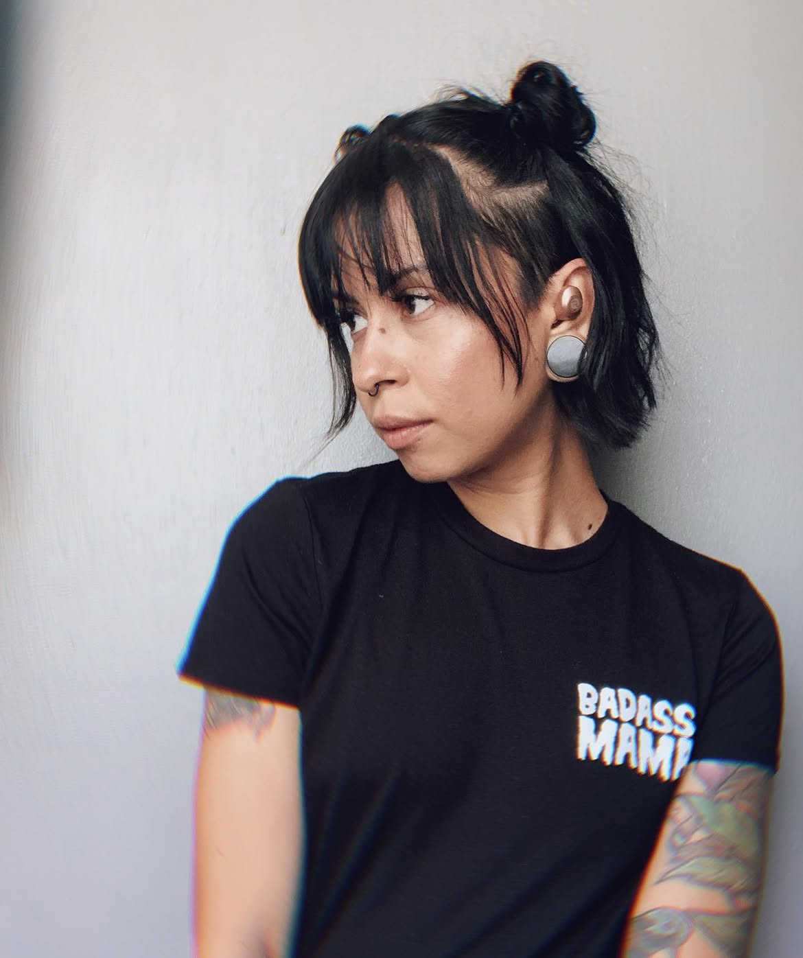 Messy Half Up Space Buns With Wispy Bangs