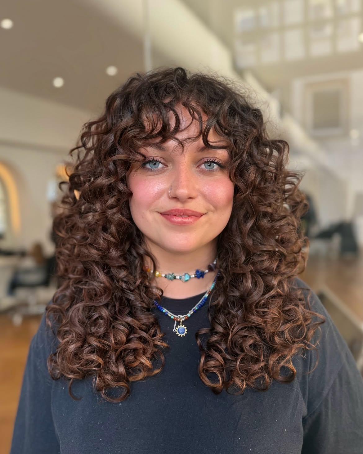 Naturally Defined Curly Hair With Textured Bangs