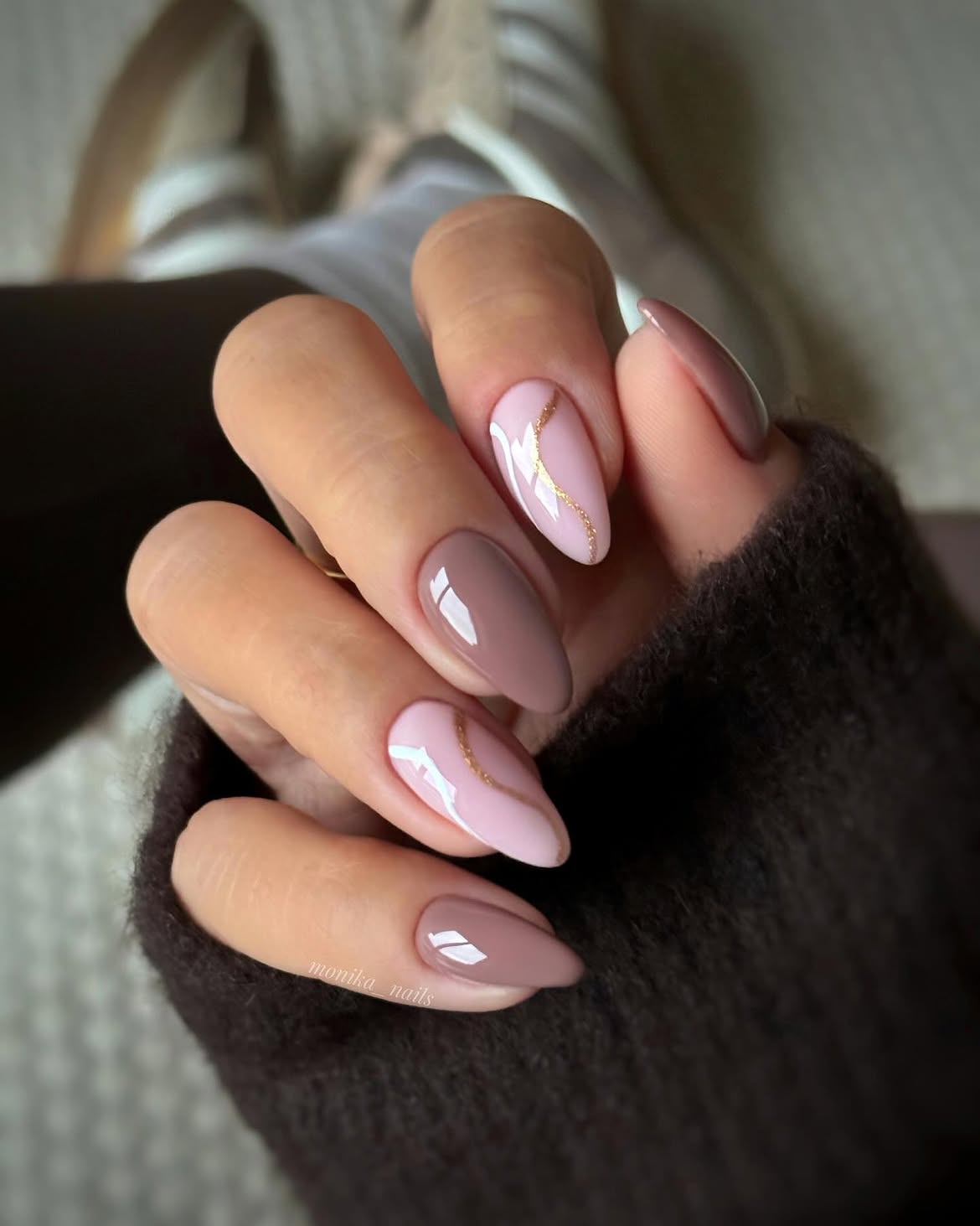 Pastel Pink and Taupe Almond Nails with Gold Swirl