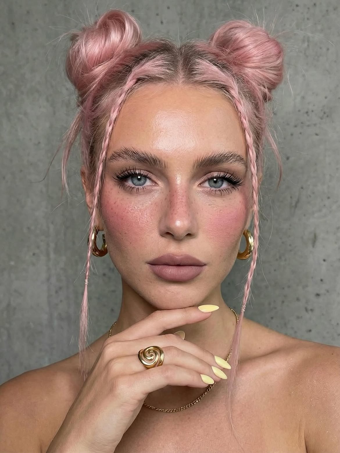 Pastel Pink Space Buns With Face Framing Braids