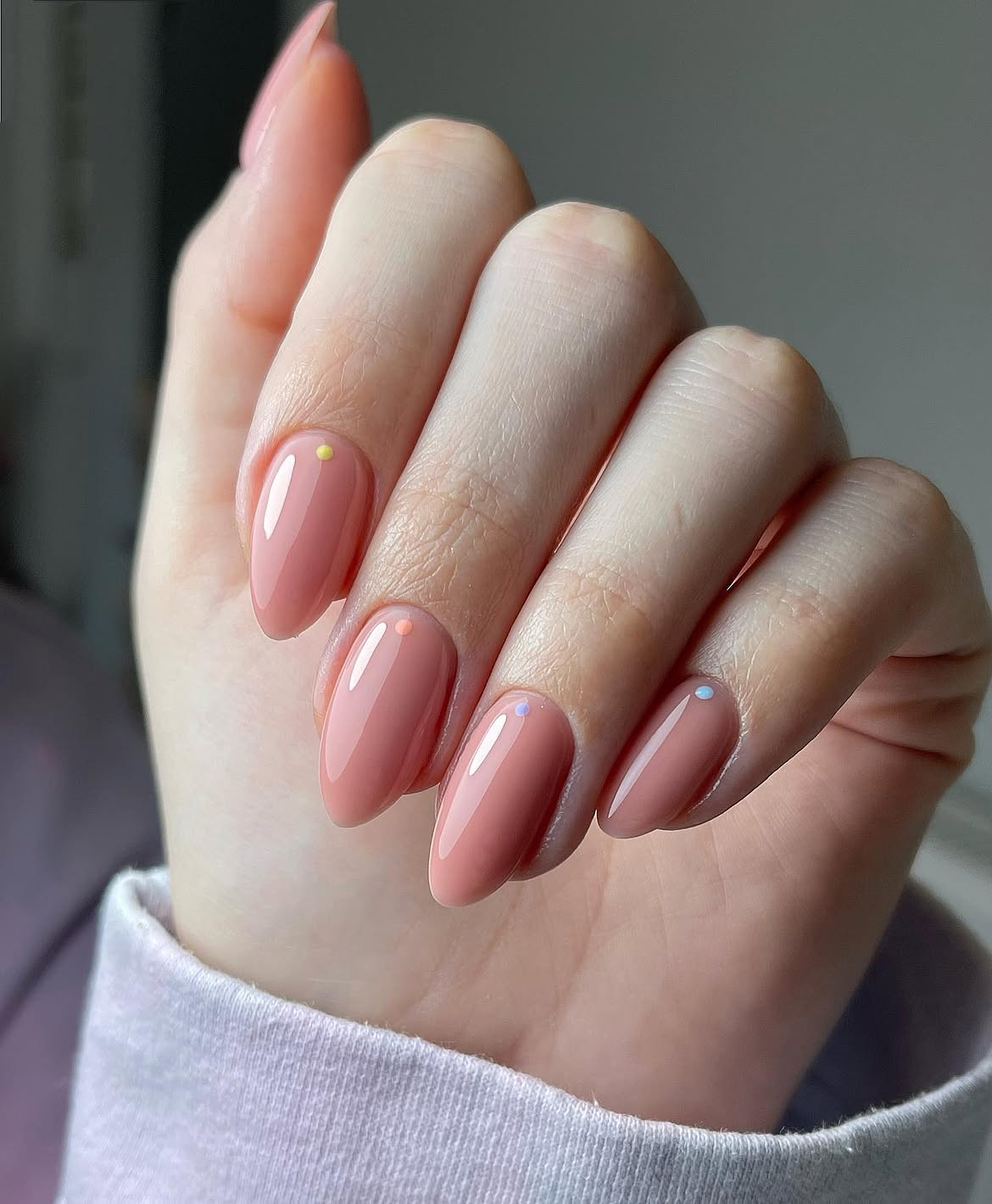 Peachy Nude Almond Nails with Tiny Dot Accent