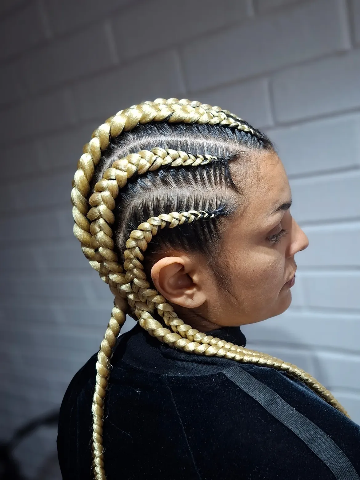 Platinum Blonde Cornrow Braids With Dark Roots