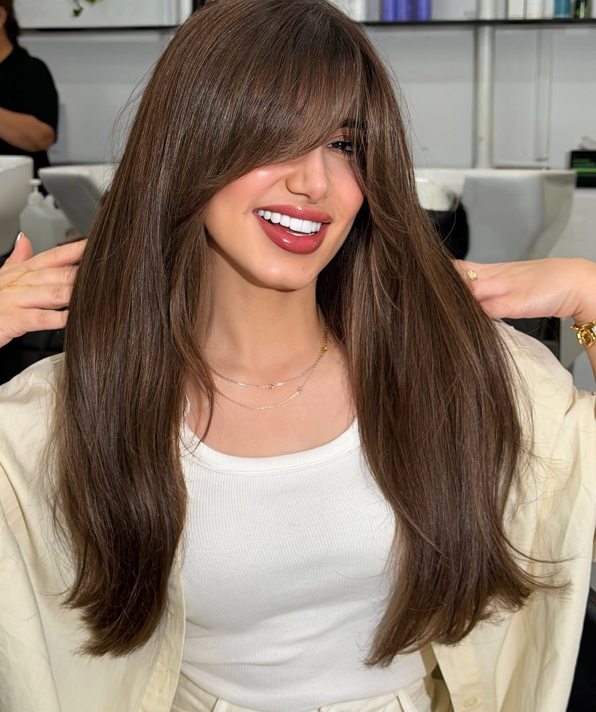 Polished Brunette Blowout With Soft Curtain Bangs