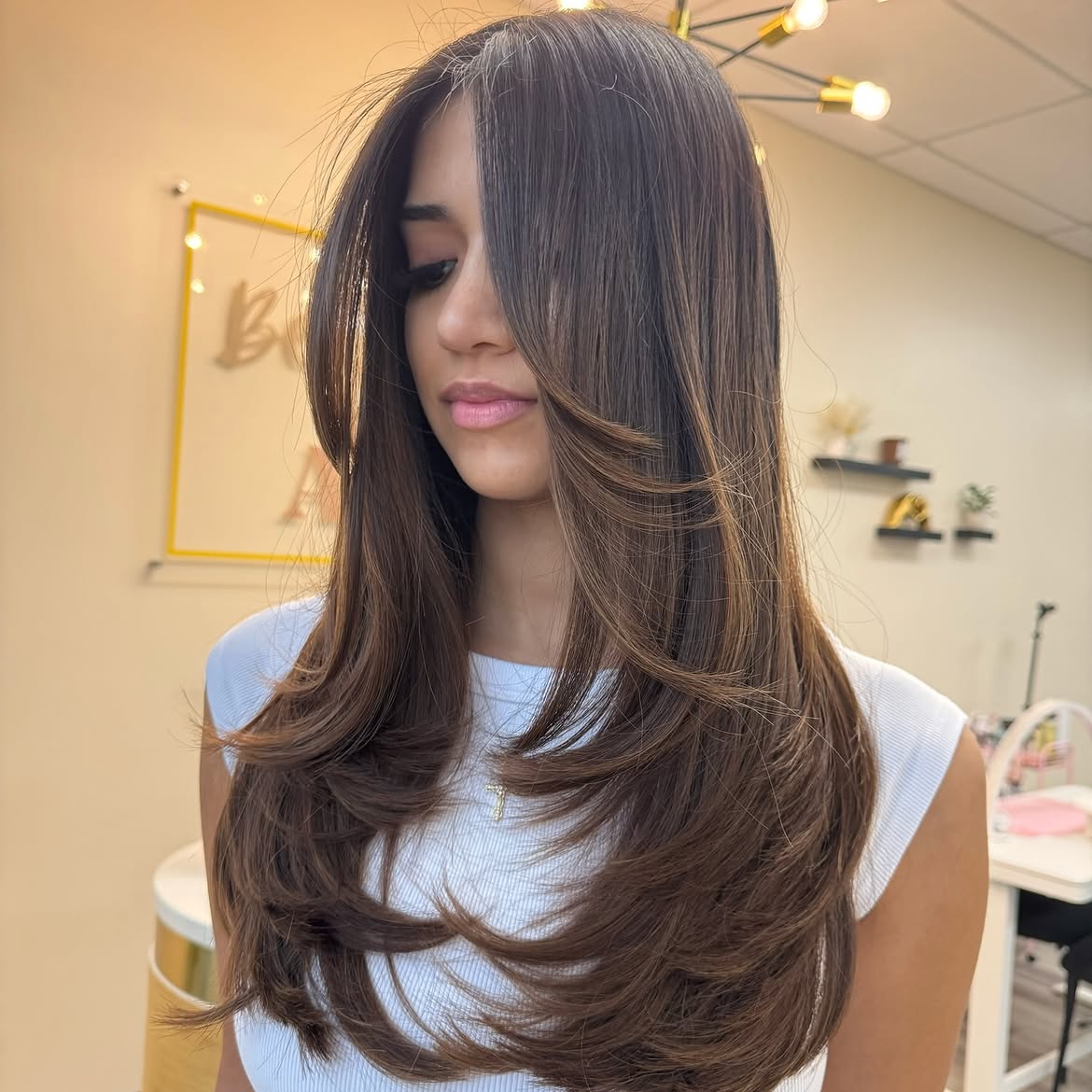 Polished Brunette Layers With Soft Curtain Bangs