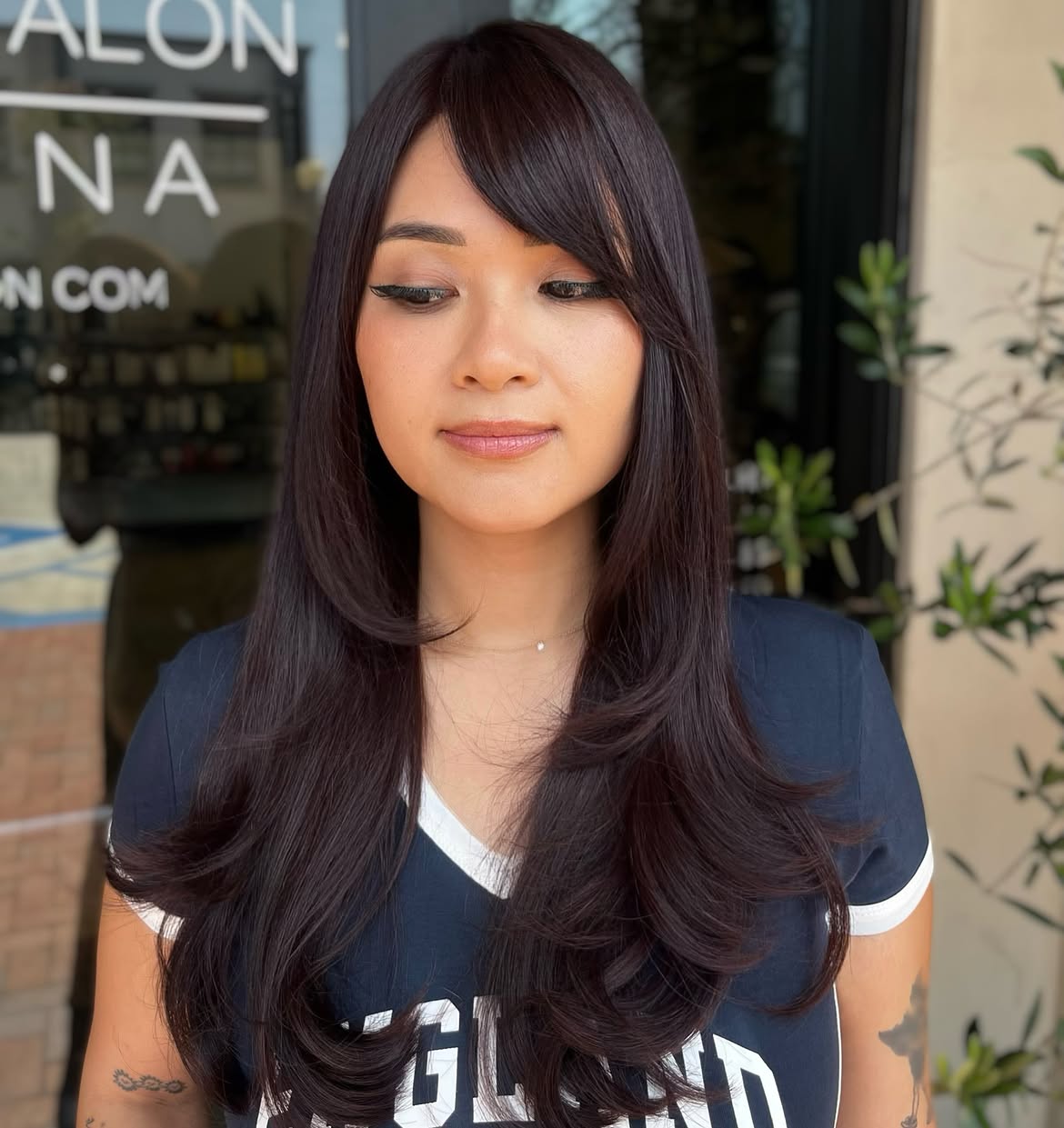 Polished Layers With Sophisticated Side Swept Bangs