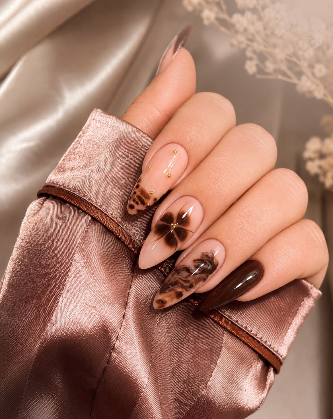 Rich Chocolate Swirl Almond Nails with Gold Accents