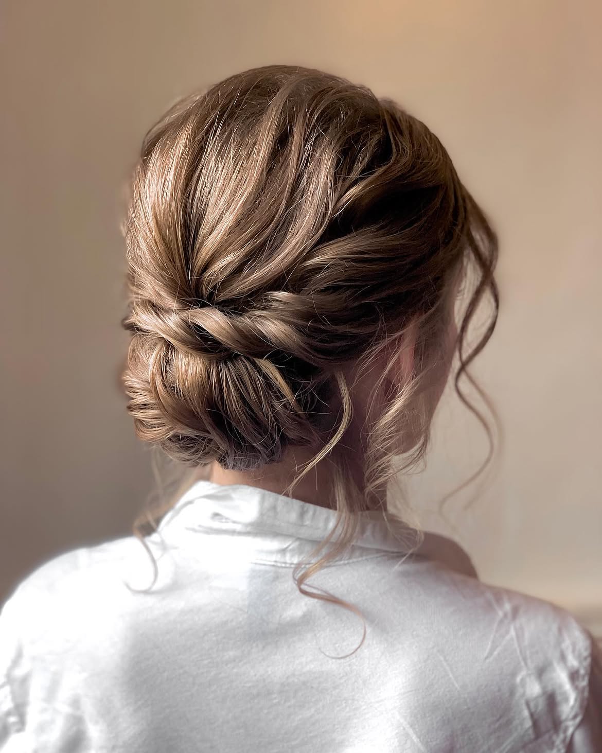 Romantic Twisted Low Bun With Face Framing Tendrils