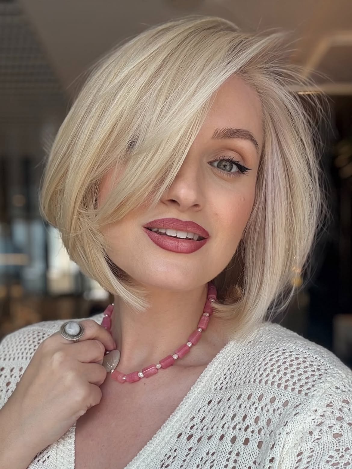 Side Swept Bangs On A Sleek Platinum Bob