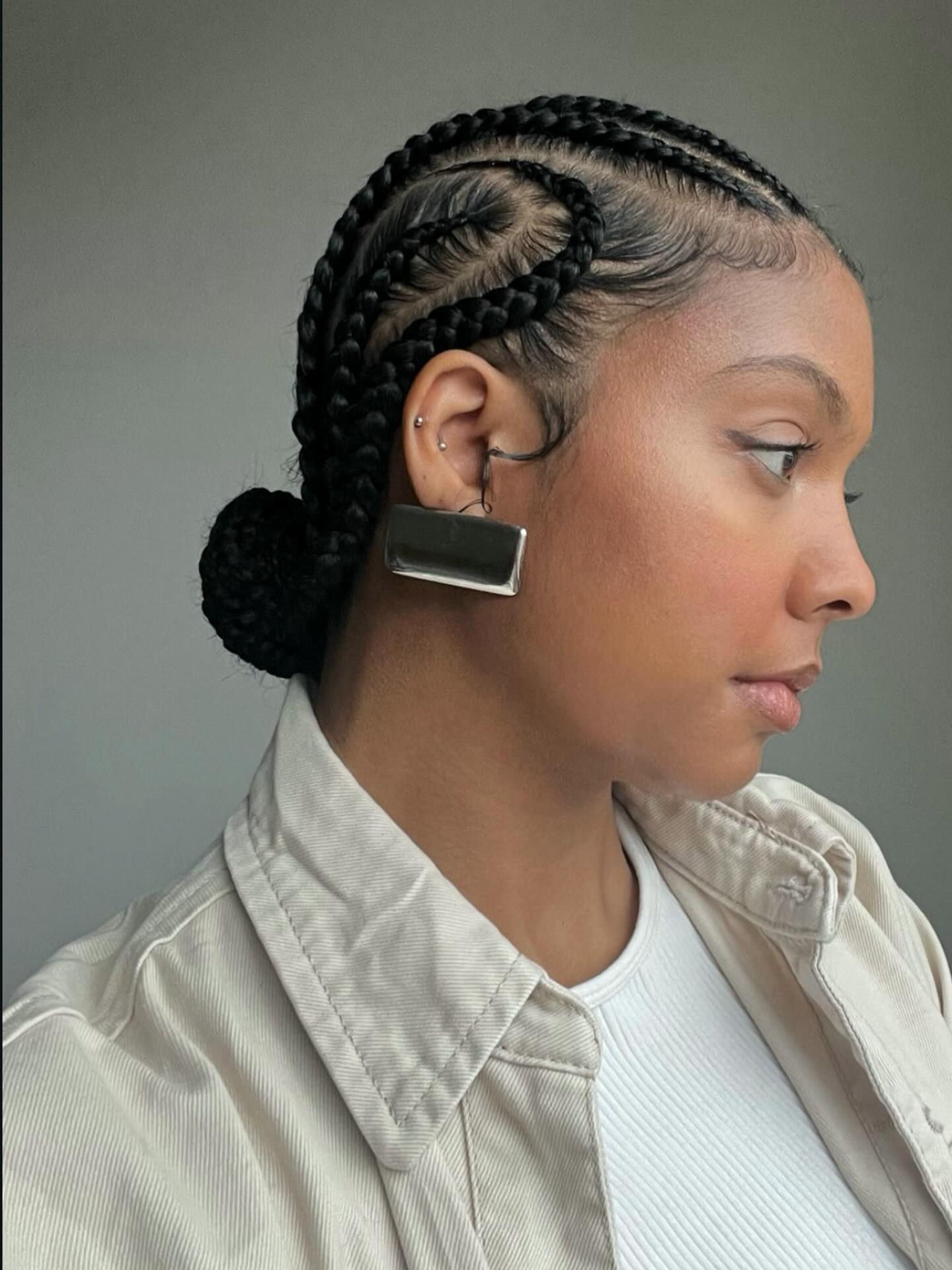 Sleek Braided Cornrow Updo With Defined Edges