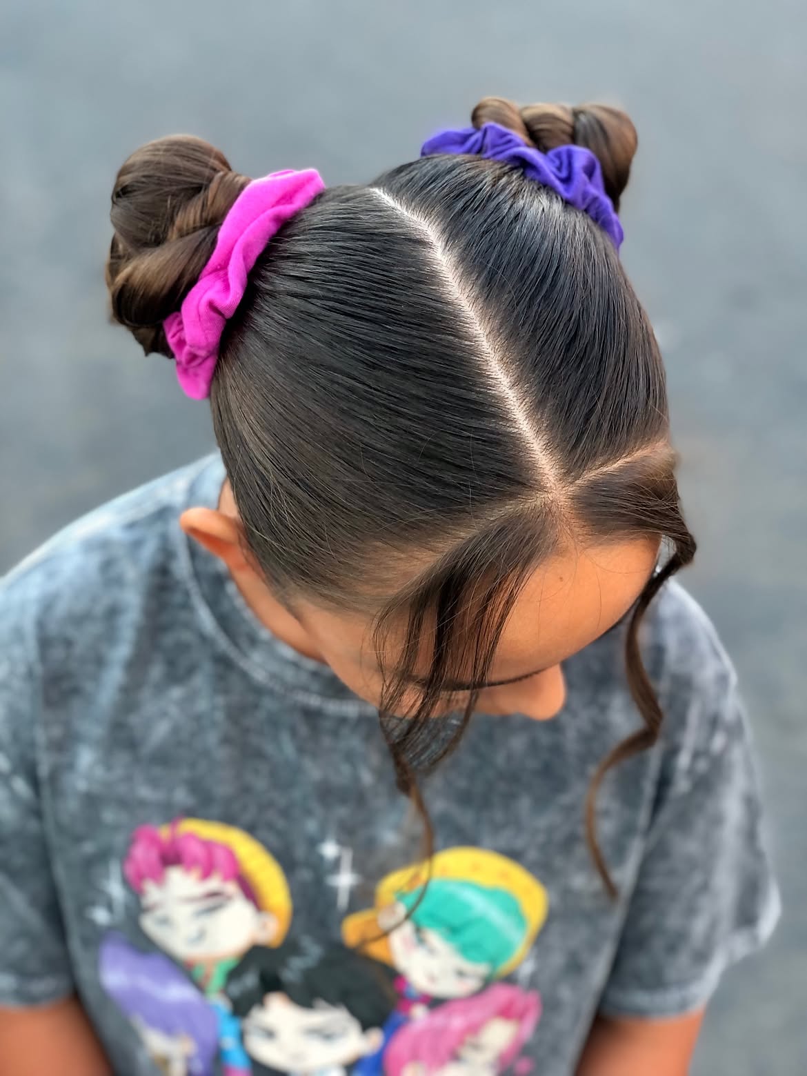 Sleek Braided Space Buns With Colorful Scrunchies