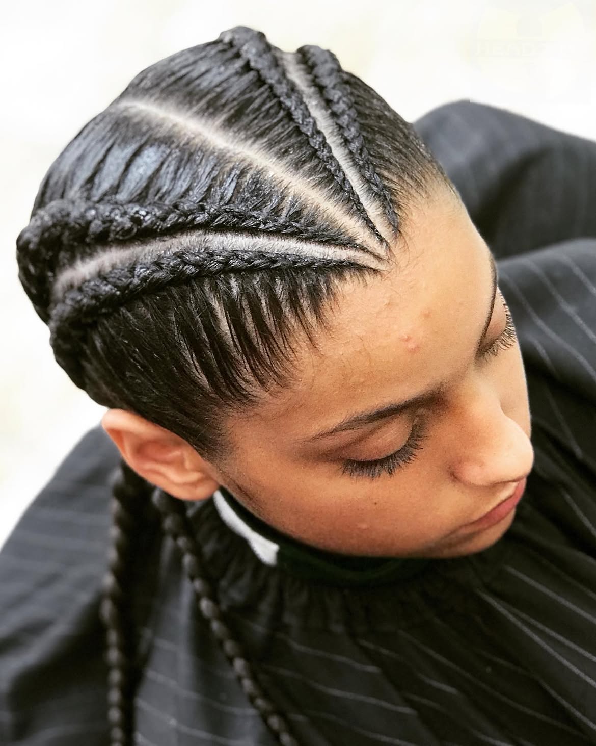Sleek Cornrow Braids With Clean Parting