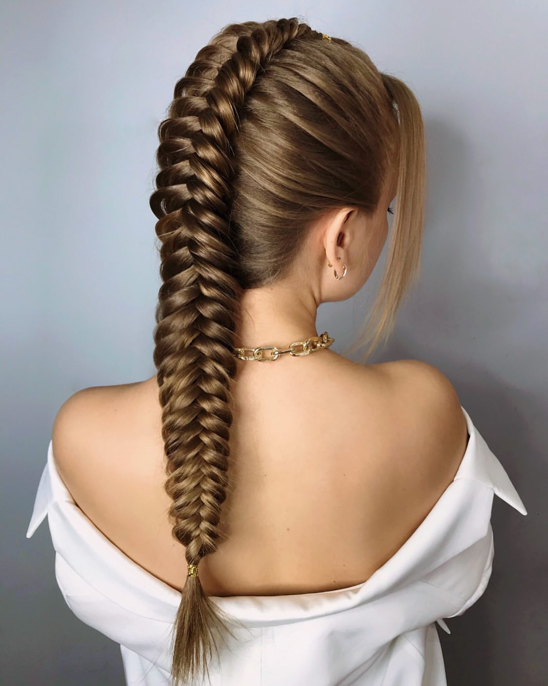 Sleek High Fishtail Braid With Face Framing Strands