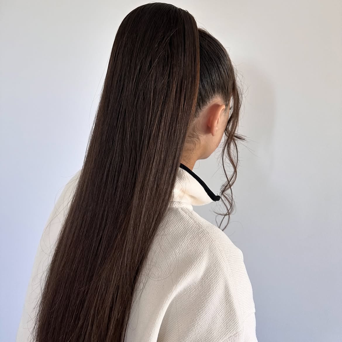 Sleek High Ponytail With Face Framing Strands