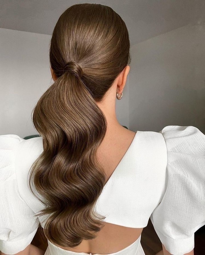 Sleek High Ponytail With Hollywood Waves