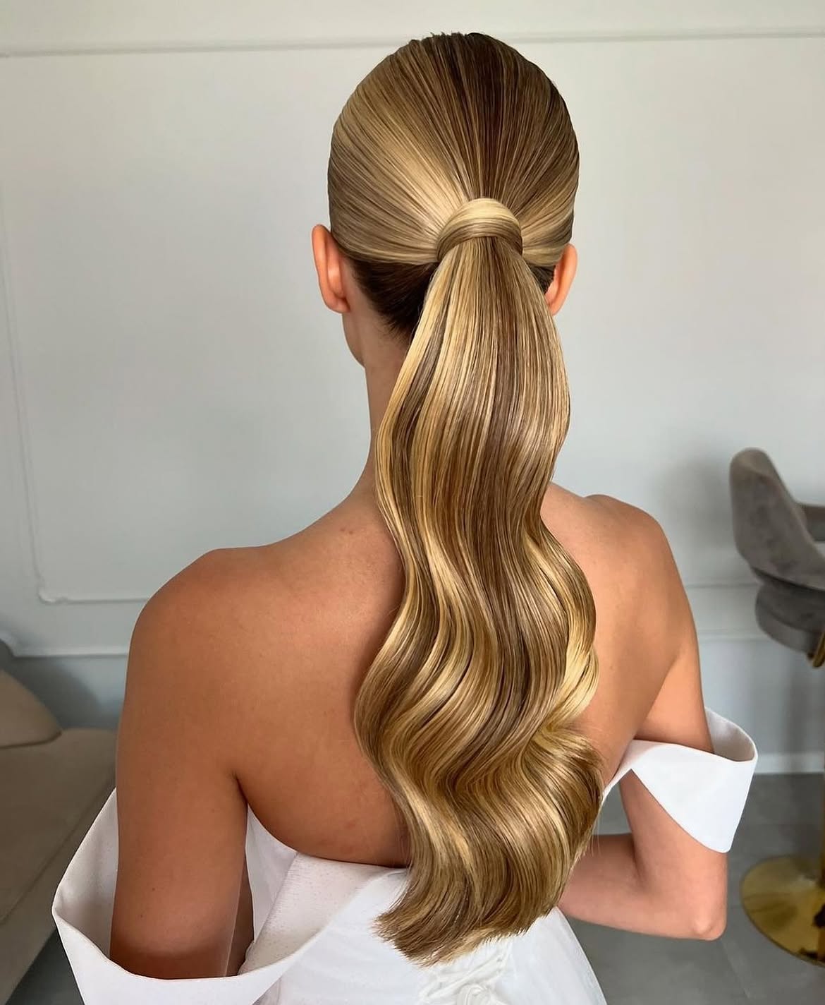 Sleek High Ponytail With Hollywood Waves