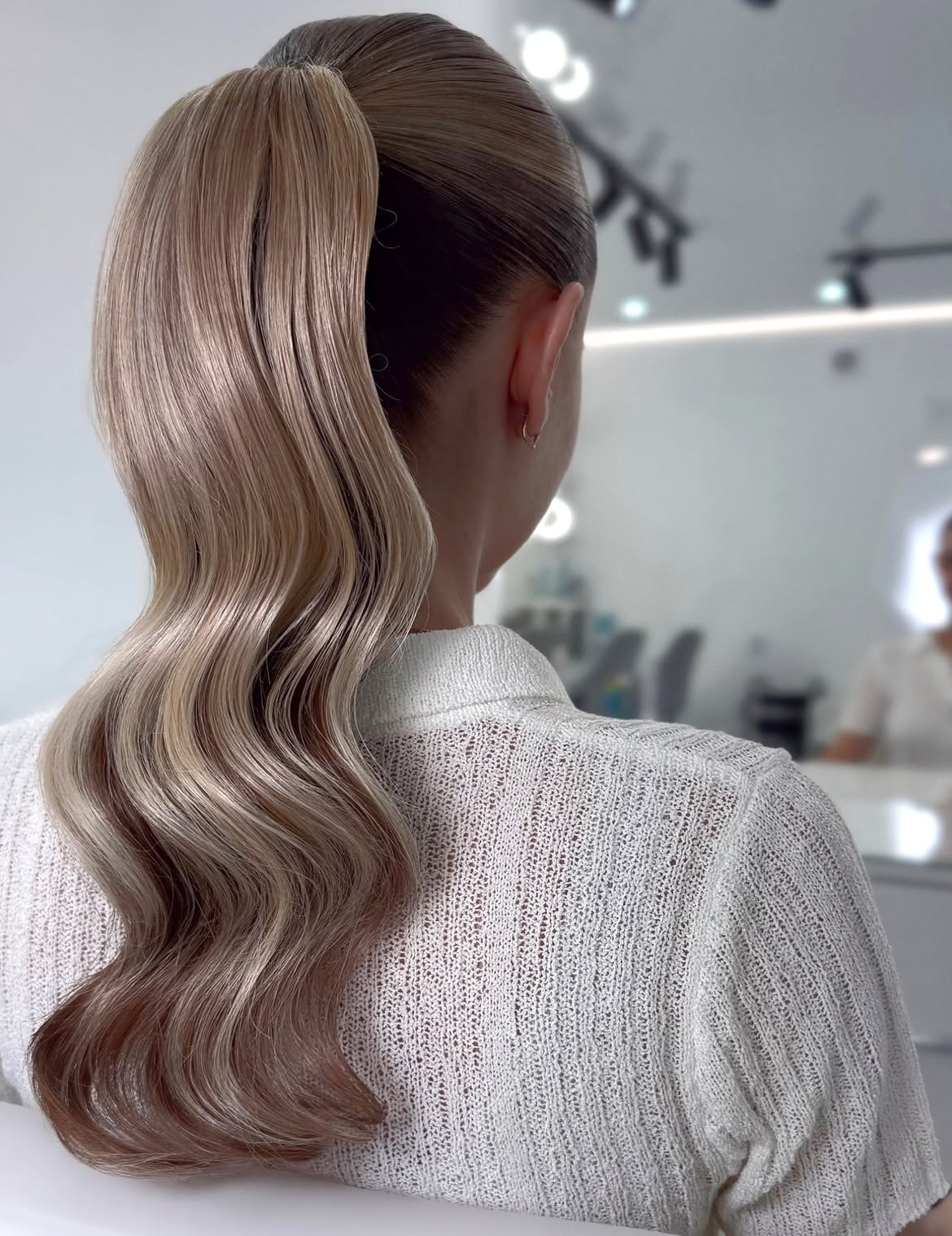 Sleek High Ponytail With Polished Hollywood Waves