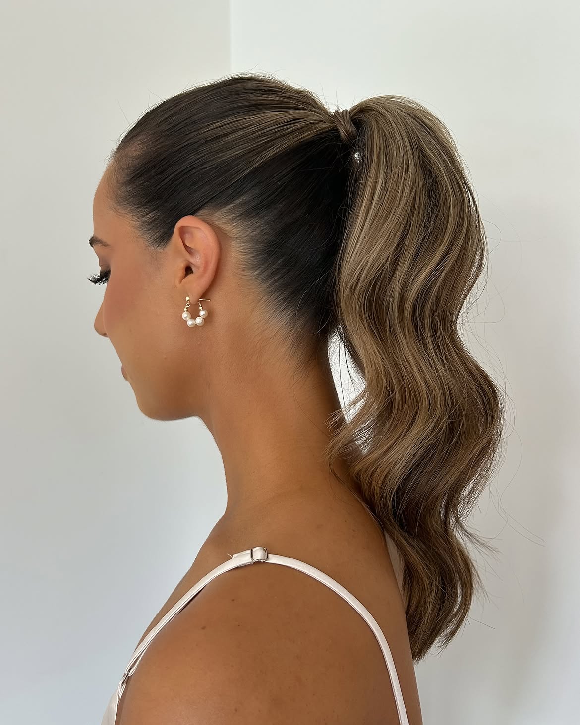 Sleek High Ponytail With Soft Wavy Texture