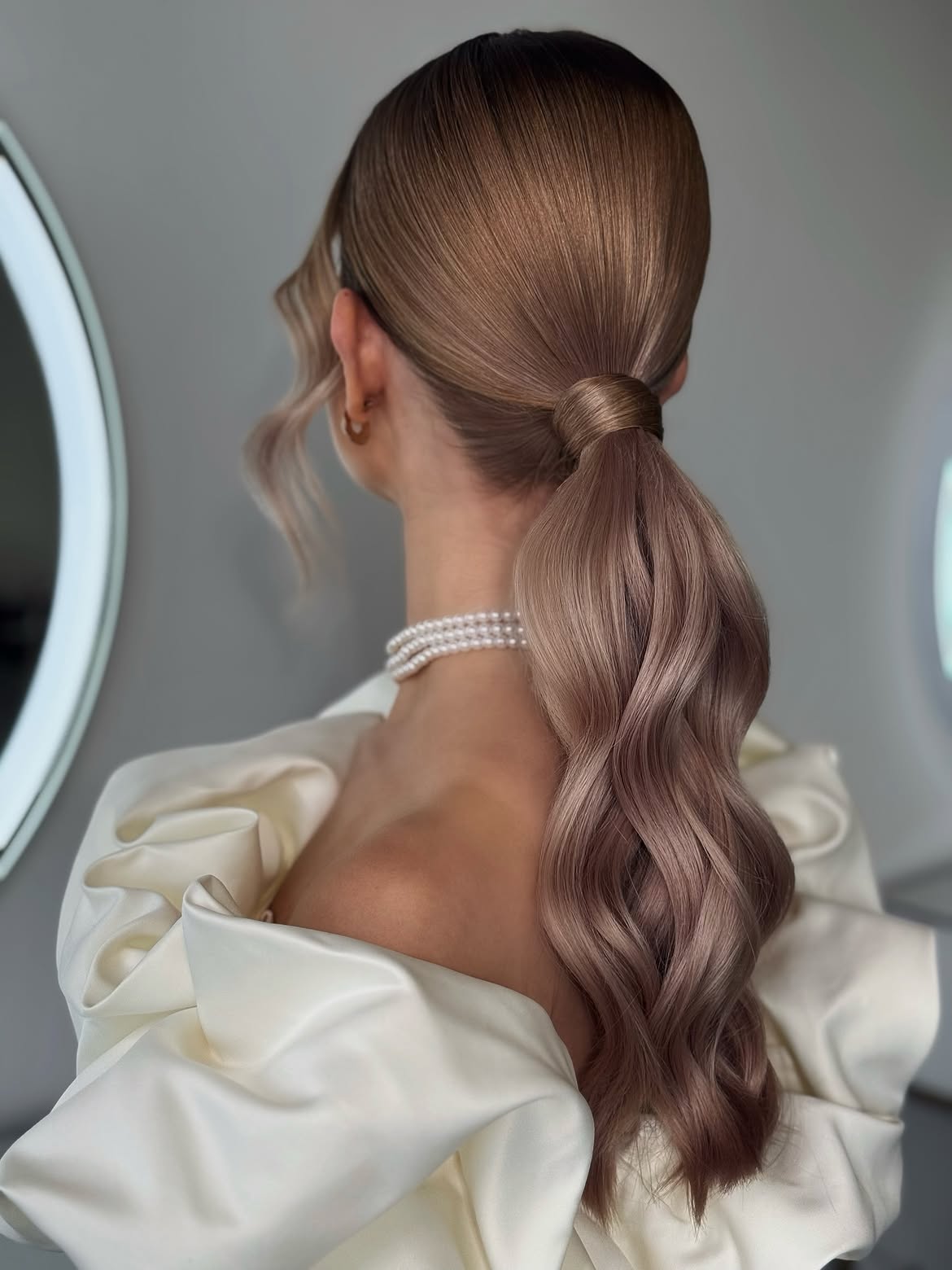Sleek High Ponytail With Voluminous Waves