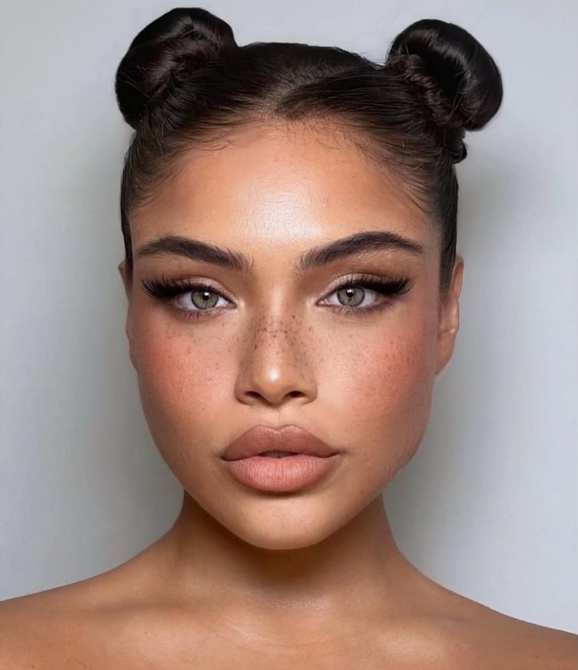 Sleek High Space Buns On Espresso Hair
