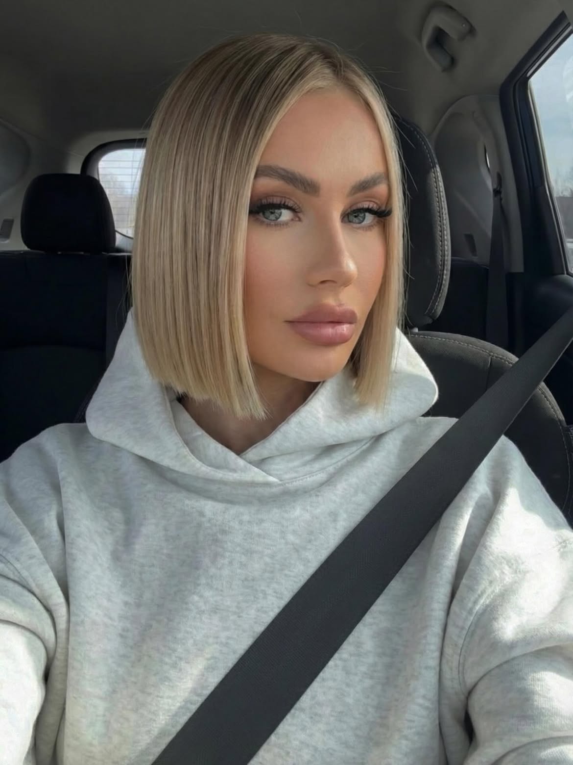 Sleek Platinum Blonde Blunt Bob With Deep Side Part