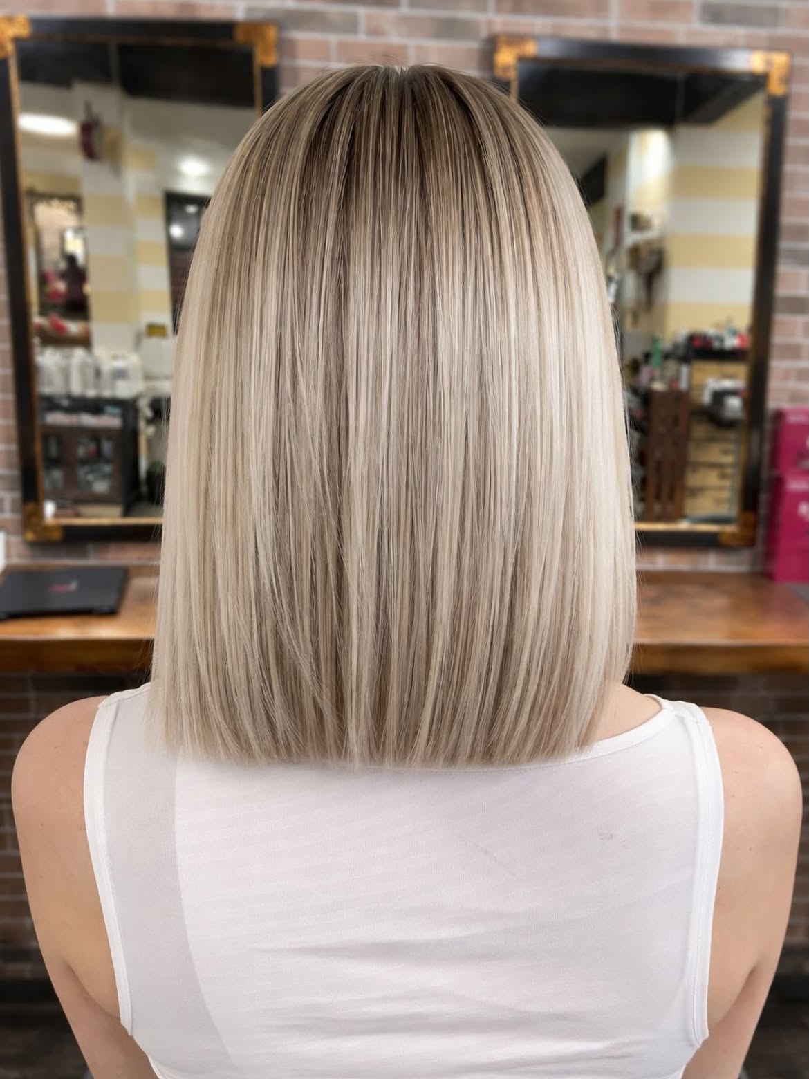 Sleek Platinum Blonde Bob With Subtle Dimension