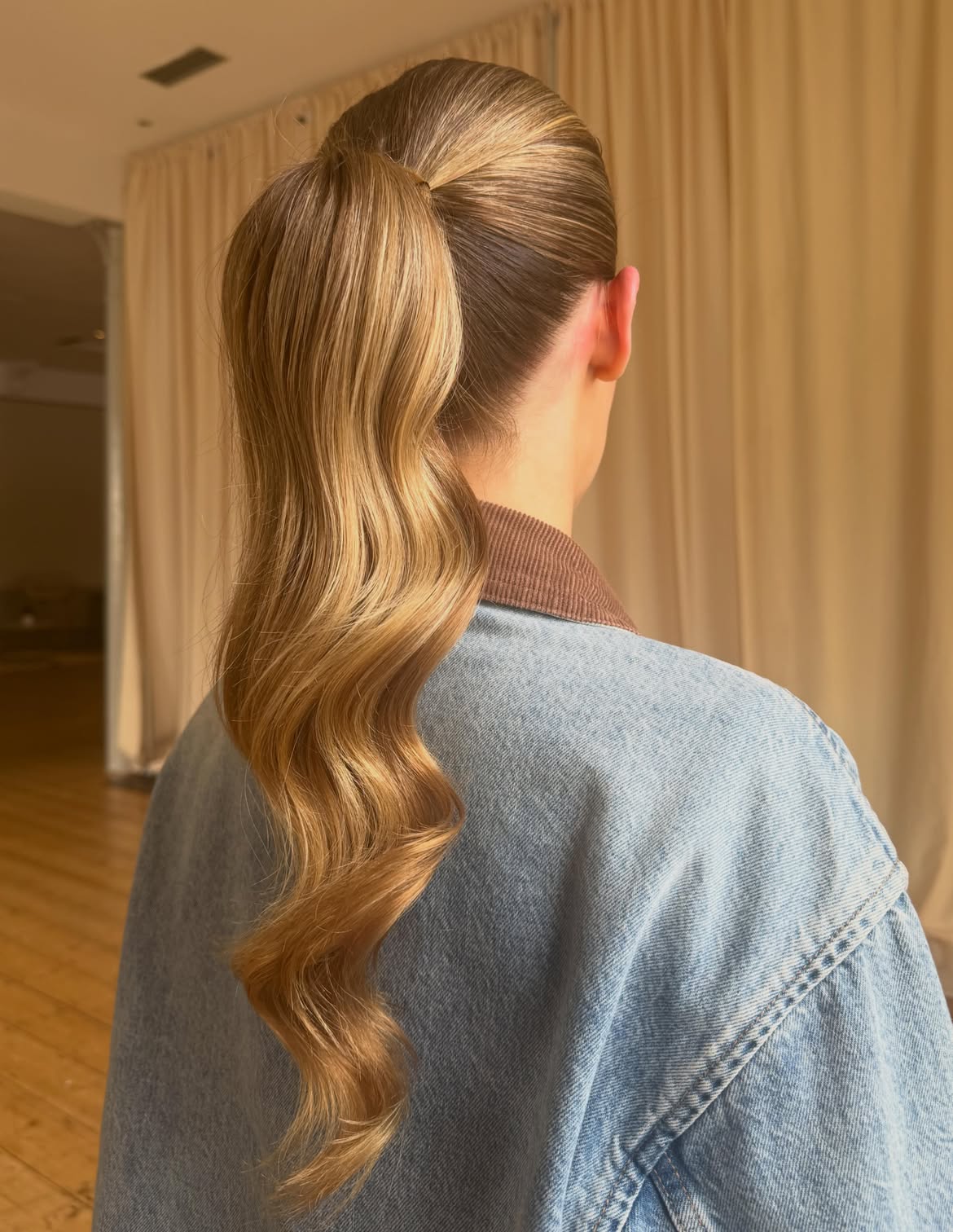 Sleek Polished High Ponytail With Soft Waves