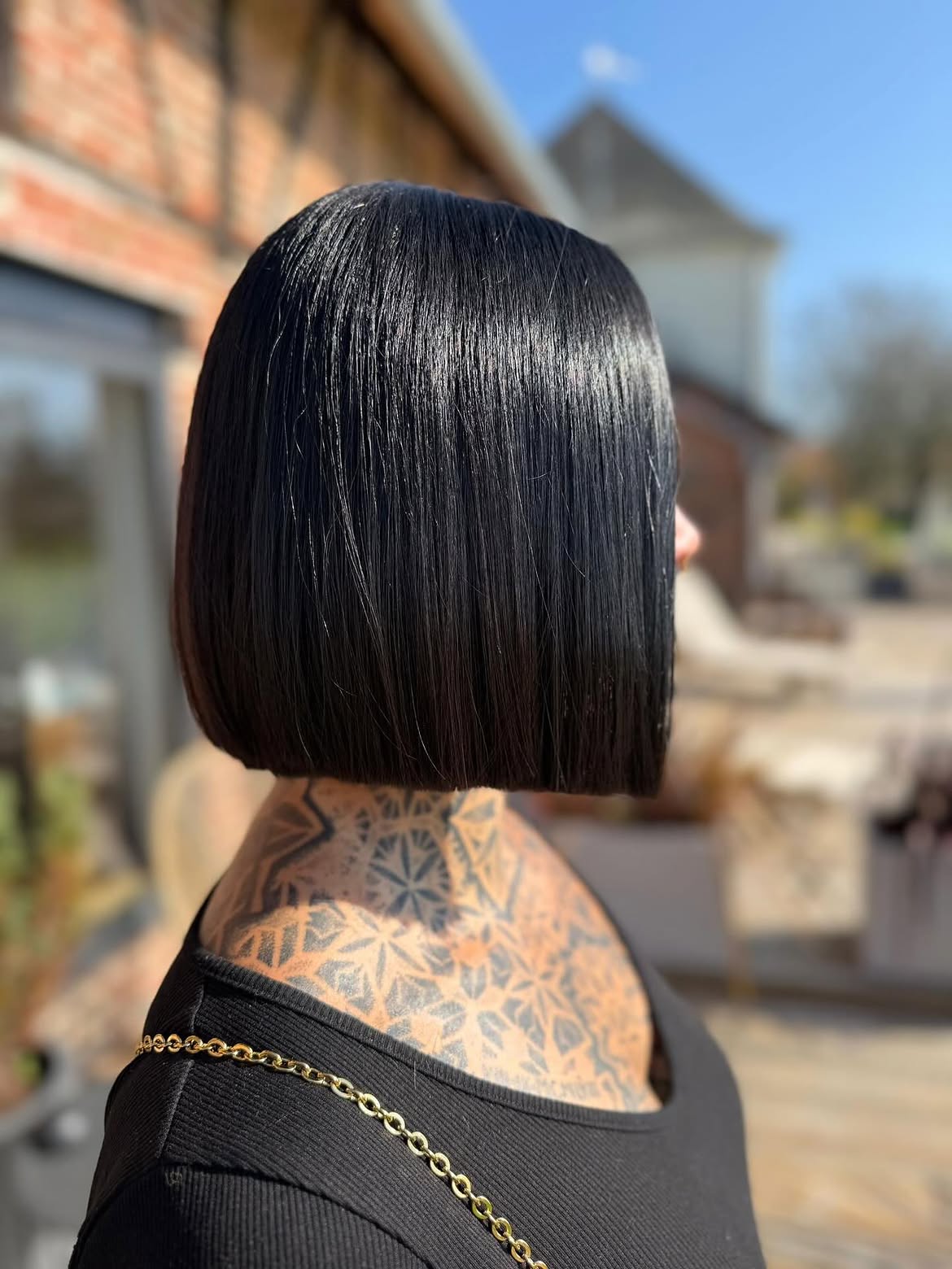 Sleek Razor Cut Black Bob With Chin Length