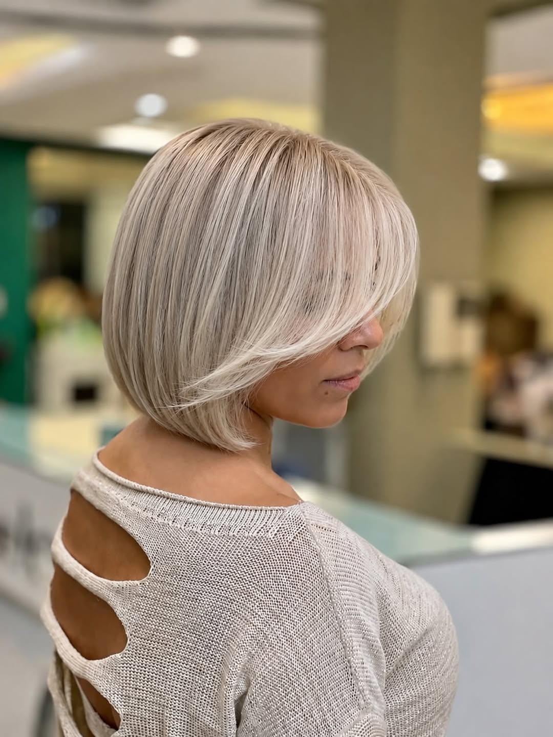 Sleek Side Swept Bangs On Platinum Blonde Bob