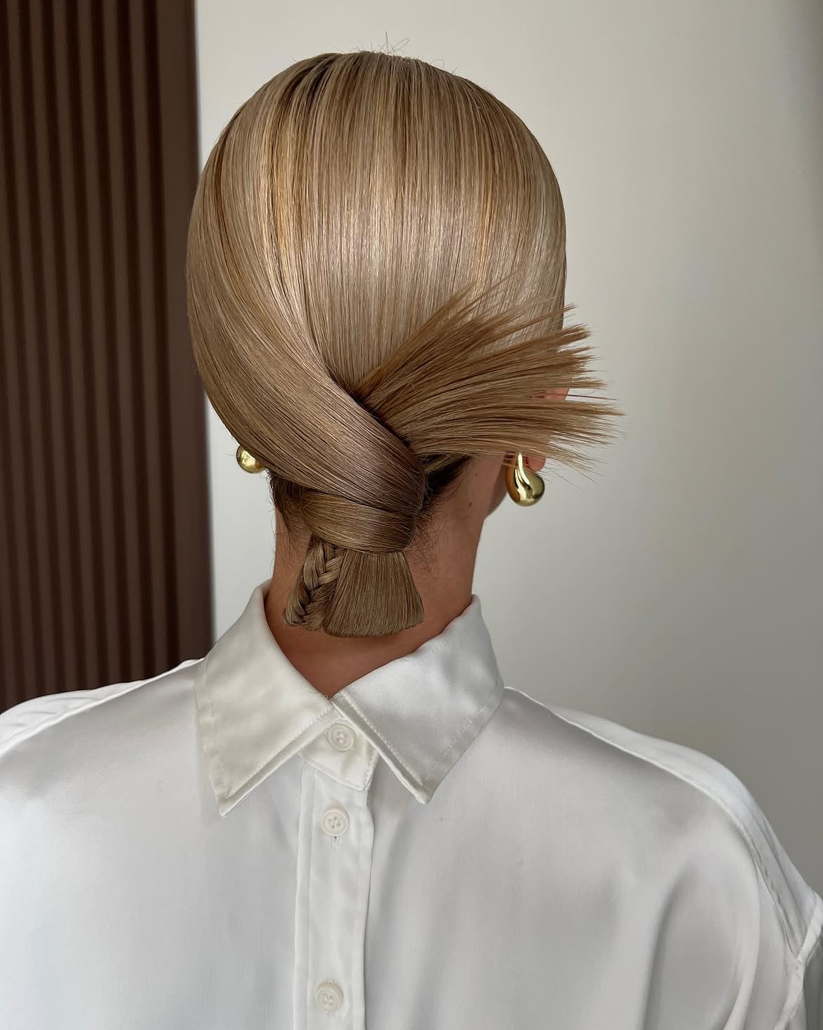 Sleek Twisted Low Bun With Braided Tail
