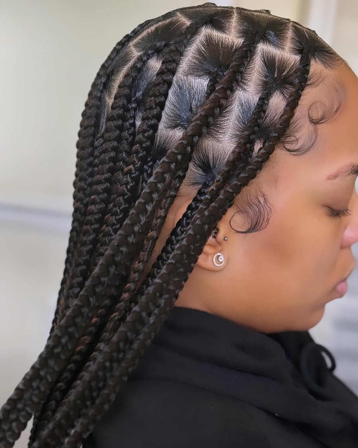 Sleek Waist Length Knotless Braids With Laid Edges