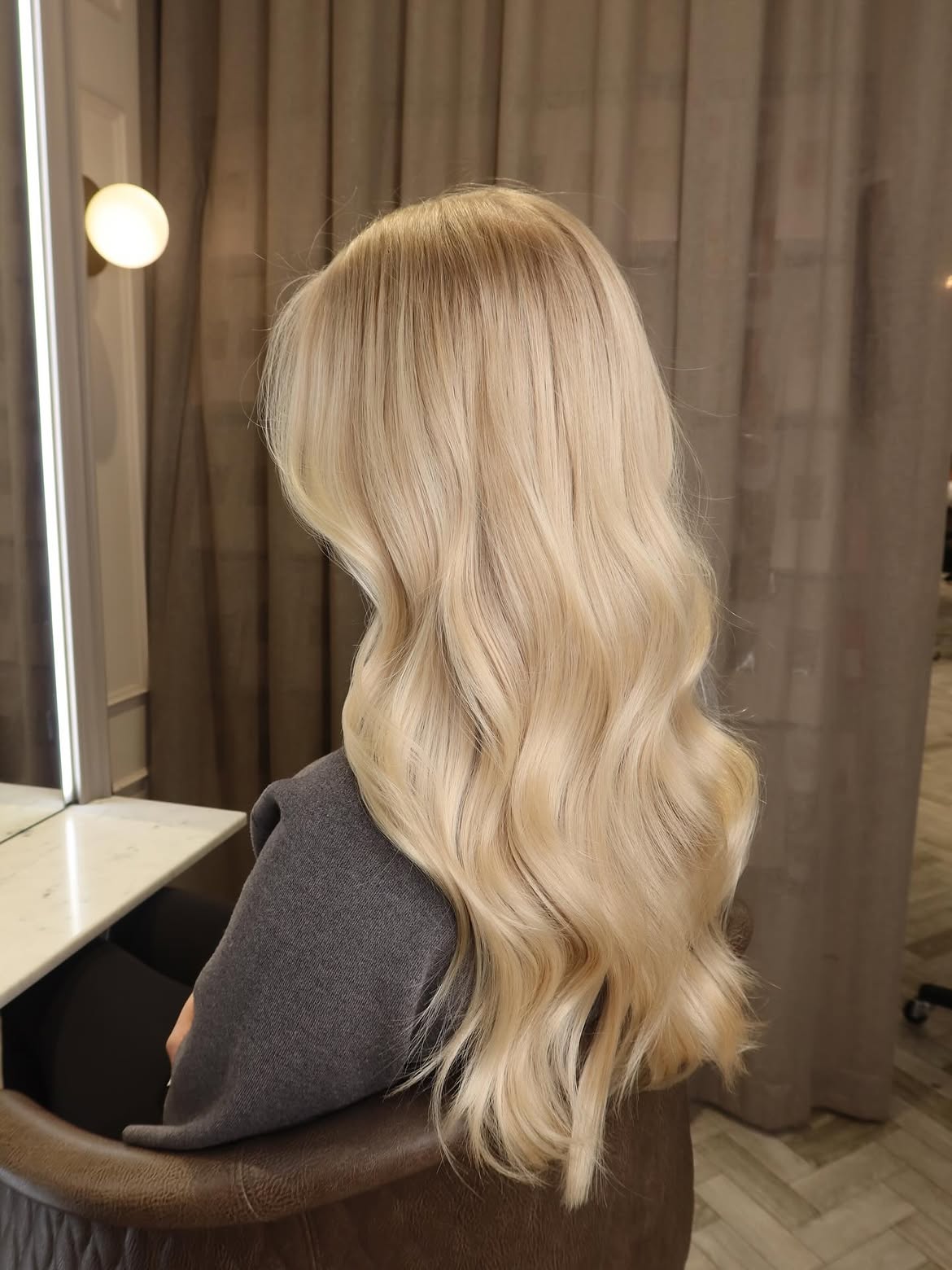 Soft Creamy Blonde Waves With Dimensional Highlights