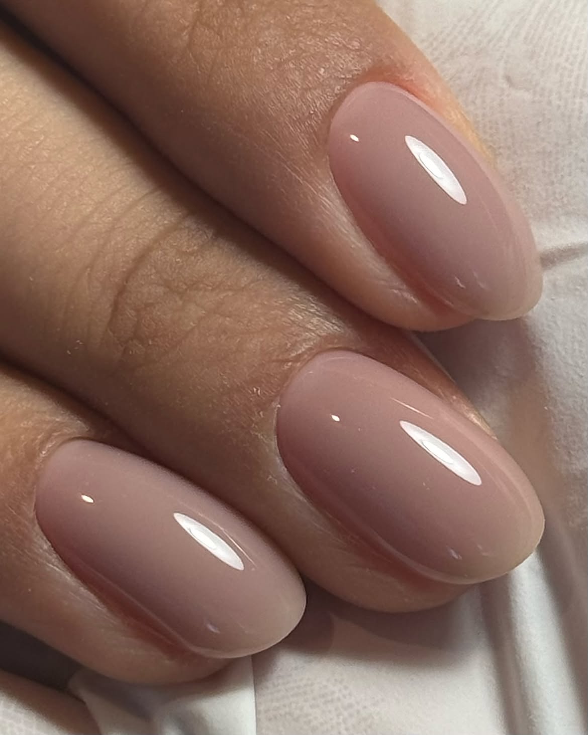 Soft Nude Oval Nails With High Gloss Finish