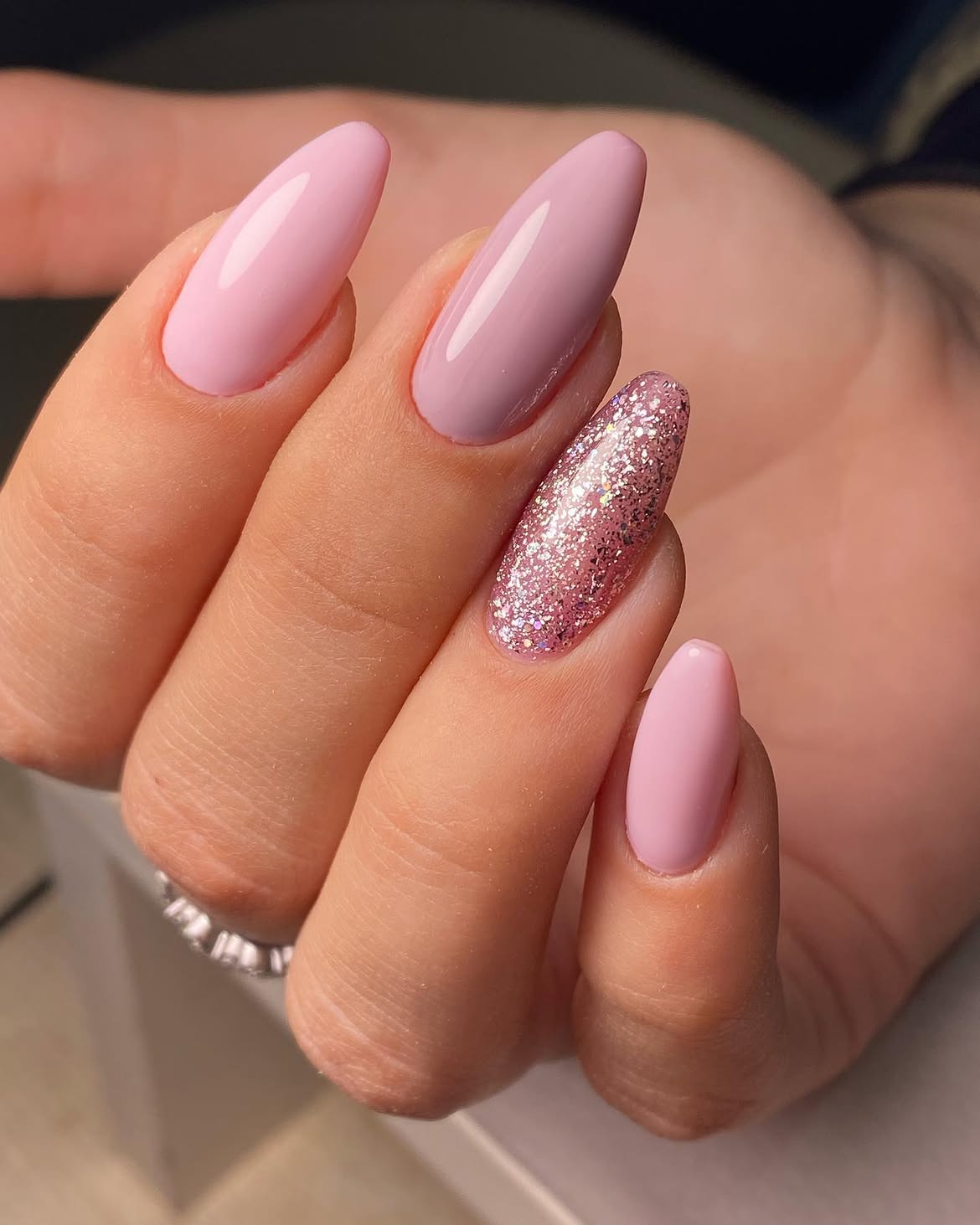 Soft Pink Almond Nails with Glitter Accent